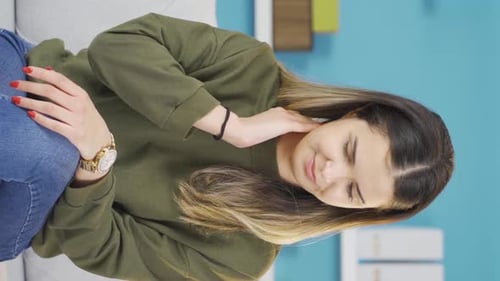Woman Rubbing Stiff Neck At Home