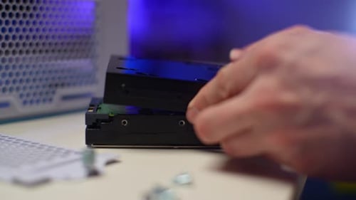Closeup Hands of Unrecognizable Man Tightening Screws Using Screwdriver of Case to Install Hard