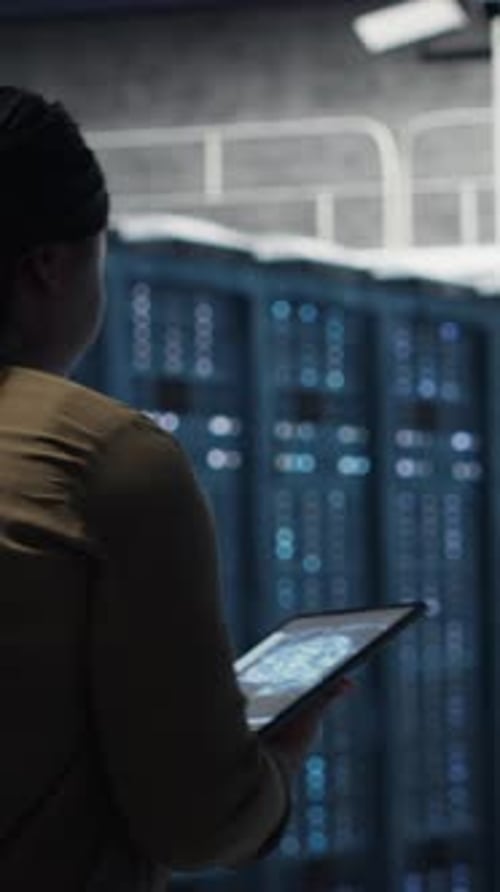 Vertical Video Developer Doing Data Center Automation Using AI Neural Networks on Tablet