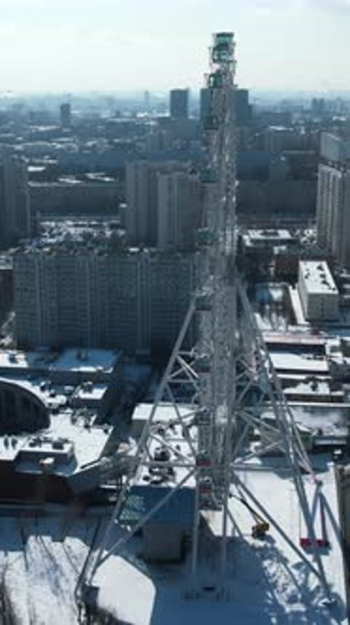 Top View of Big Ferris Wheel in Winter Creative Beautiful Urban Landscape with Ferris Wheel in City