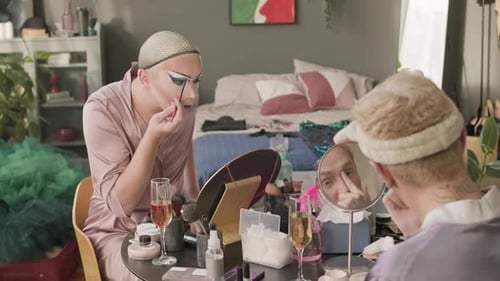 Queer Men Applying Make Up in Cluttered Apartment