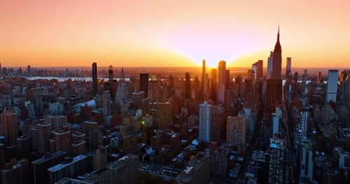 Golden hour in the modern metropolis. Aerial perspective on the vast scenery of New York, the USA