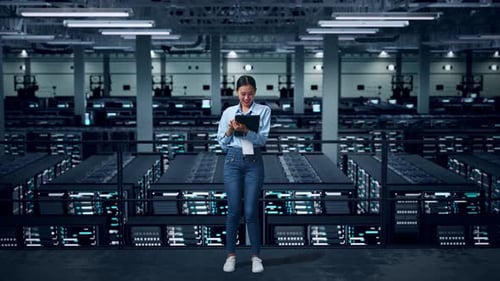 Full Body Of Asian Business Woman Using Tablet In Data Center