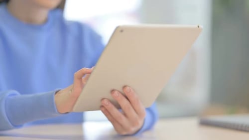 Close up of Woman using Tablet, Browsing Internet
