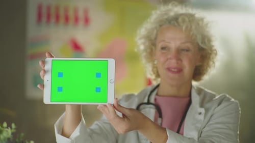 Doctor showing tablet horizontally