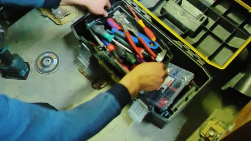 Rebuilding Hope Worker Organizing His Tools Symbolizing Renewal After Crisis