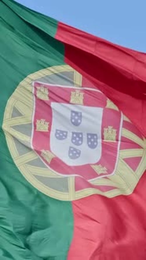 National Flag of Portugal Waving in the Wind on Clear Sunny Day at Blue Sky Real Footage Selective
