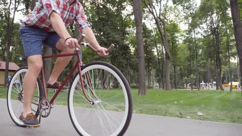 Unrecognizable Young Man Riding a Vintage Bicycle Sporty Guy Cycling at the Park Healthy Active
