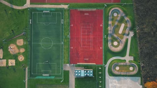 Recreational green grass active sports hockey and football fields overhead top down view. Competitio