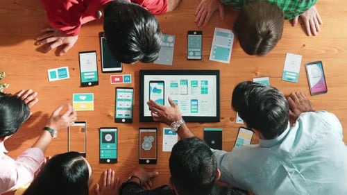 Top view of software developer team looking Ux design from tablet. Convocation.