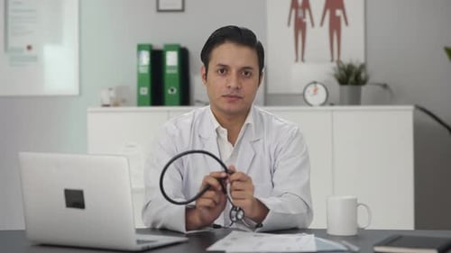 Confident Doctor Removes Stethoscope in Bright Office