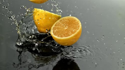Lemon Slices Fall on a Wet Surface Filmed on a Highspeed Camera at 1000 Fps