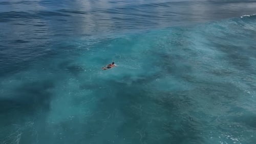Lonely Surfer in the Ocean