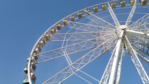 White Big wheel spinning at an Amusement park.