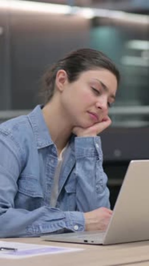 Tired Indian Woman Taking Nap While Working in Office, vertical video
