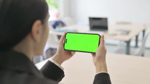 Close Up of Businesswoman Holding Smartphone with Green Screen