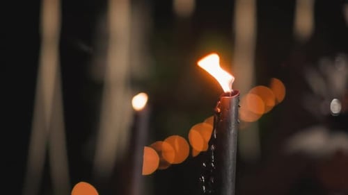 Burning Black Candles Glowing in the Dark