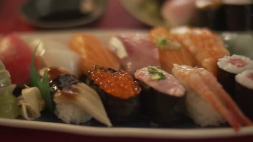 Platters Of Delicious Assorted Sushi Served In A Sushi Restaurant In Tokyo, Japan - close up, tracki
