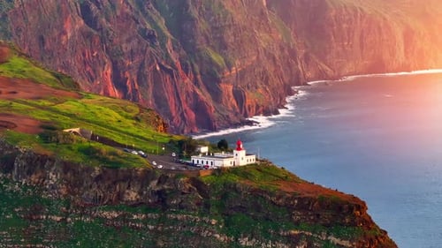 Coastal Lighthouse and Rugged Cliffs Aerial View