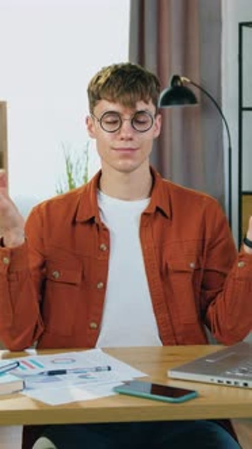 Man Meditating at Desk