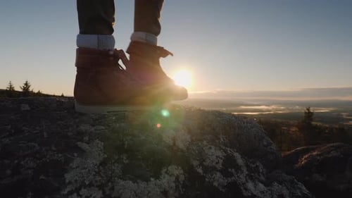 Feet on a Large Stone at the Top of the Mountain