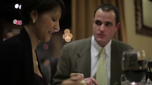 Couple enjoying an extravagant dinner at a fine dining restaurant