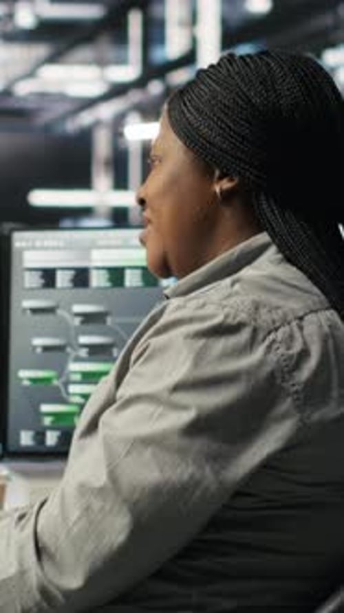 Vertical Video Data Center Employee Deploying AI Solutions Optimizing Equipment
