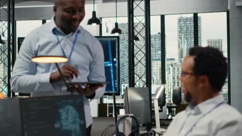 Smiling IT Staff Members in Office Using AI to Optimize Company Systems