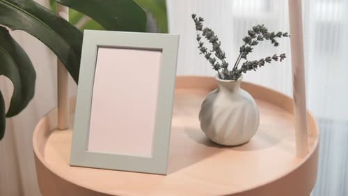 Stylish Home Decor with Vase and Empty Frame on Table