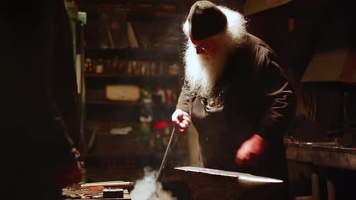 Craftsperson Blacksmith Working Anvil in Dark Workshop