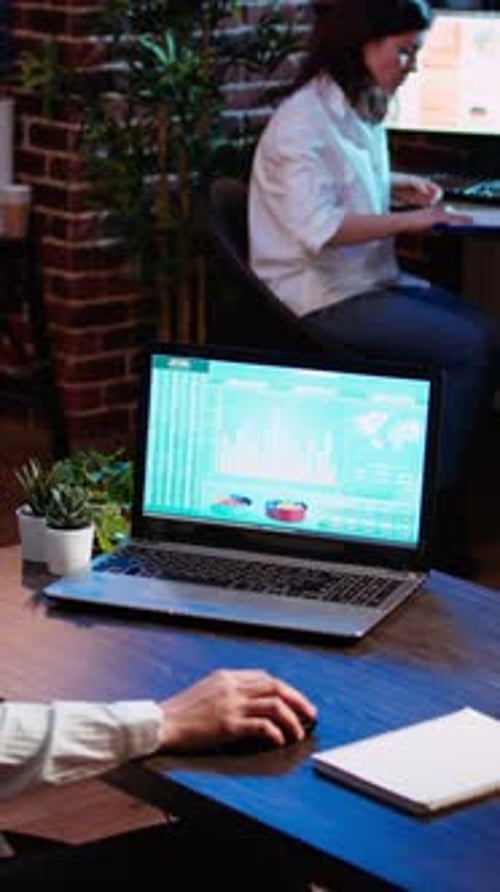 Vertical Video Businesswoman Concerned About Statistical Data Financial Graphs on Laptop