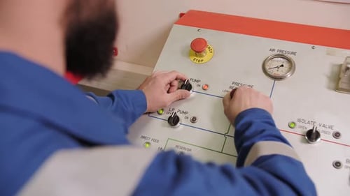 Specialist Stands at the Control Panel Apparat for Checking Oil Drill Pipes