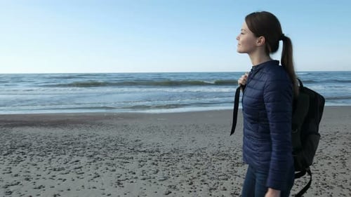 One Adult Smiling Lady with Rucksack Wearing Jacket Alone Walk on The