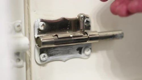 Locking a door correctly with a simple latch on a closer view.