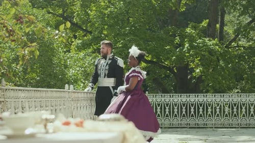 Nobleman and Lady in Period Dress Talking on Outdoor Terrace of Royal Palace