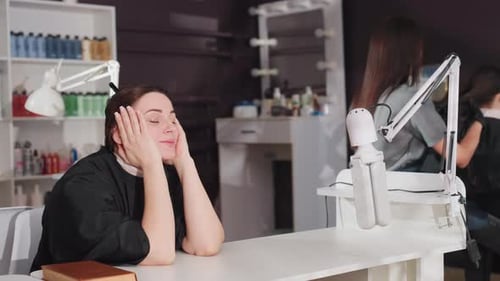 Woman Relaxing at Beauty Salon as Stylists Work