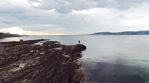 Aerial Glimpse Volcanic Rocky Norway Amidst Cloudy Cold Weather Immersed in Wilderness