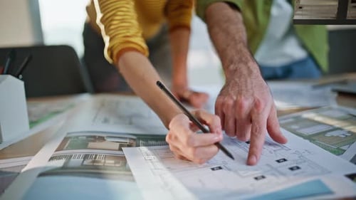 Interior Architects Reviewing Plan Building at Workplace Closeup African Woman