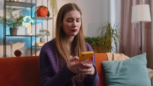 Woman Using Smartphone Looks Distressed