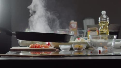 Cook Casually Stirs the Vegetables in the Pan