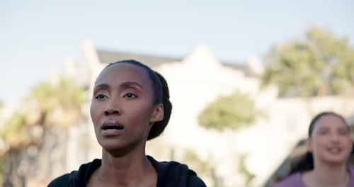 Women Exercising Outdoors in City Park