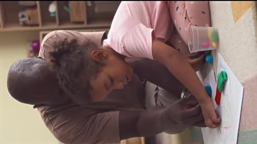 Child and Adult Create Art with Modeling Clay