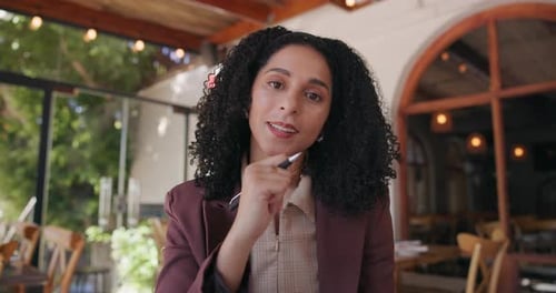 Media agency, video call and woman with face, writing in cafe and online interview for article