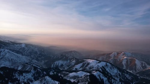 Epic Redorange Sunset in High Snowy Mountains