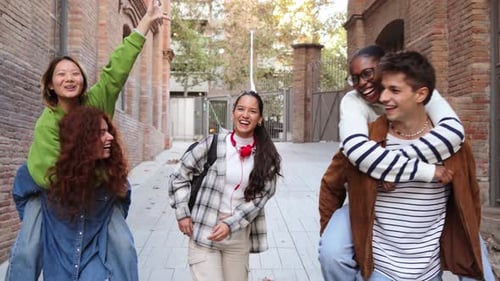 Friends Enjoying Piggyback Rides in an Urban Setting