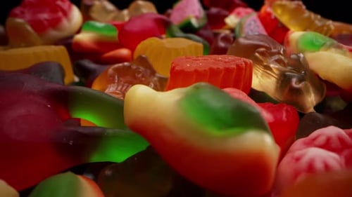 Couleurs vives de bonbons gélifiés à la gelée et oursons sucrés avec revêtement sucreMacro View