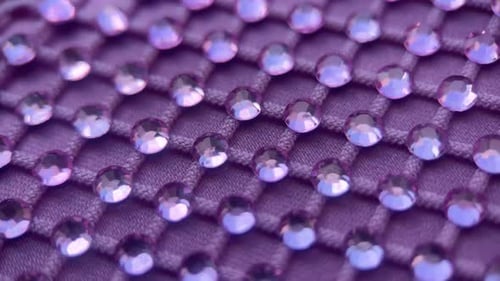 Cristales de rotación sobre fondo de tela