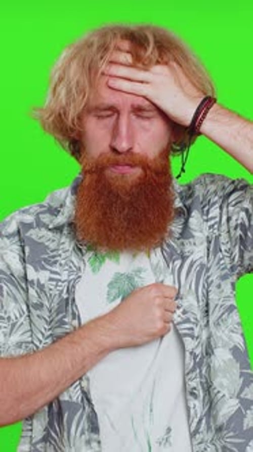 Man Coughing from Sickness Against Green Background