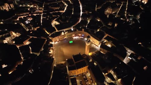 Aerial view of Siena cityscape in Siena at night, Tuscany, Italy.