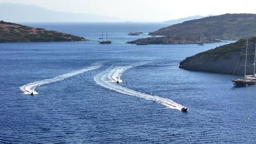 Jet Skis Speeding across Beautiful Blue Ocean